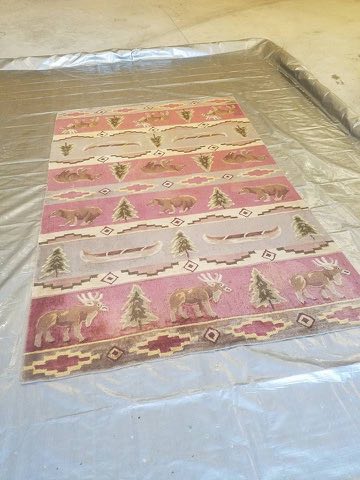 The same pink lodge-pattern wool area rug after cleaning, colors restored, in Myers Park