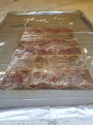 Pink lodge-pattern wool area rug before cleaning in a Myers Park, Charlotte home
